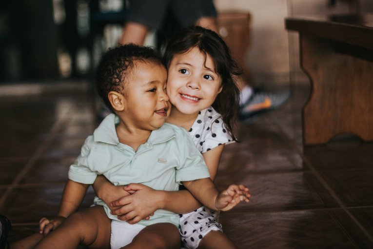 Siblings hugging